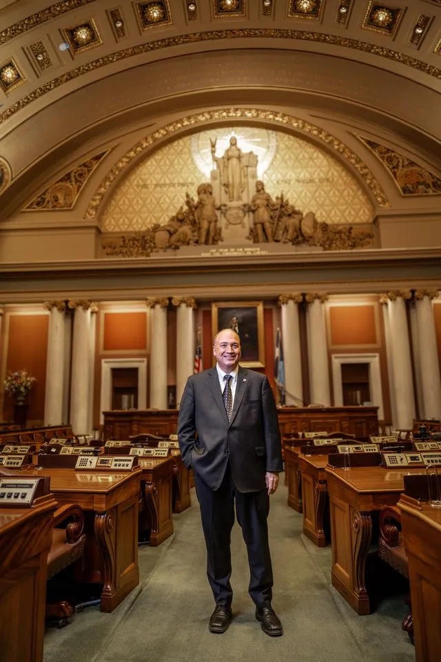 John Huot standing in the Minnesota House chamber.