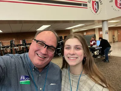 John Huot with a volunteer